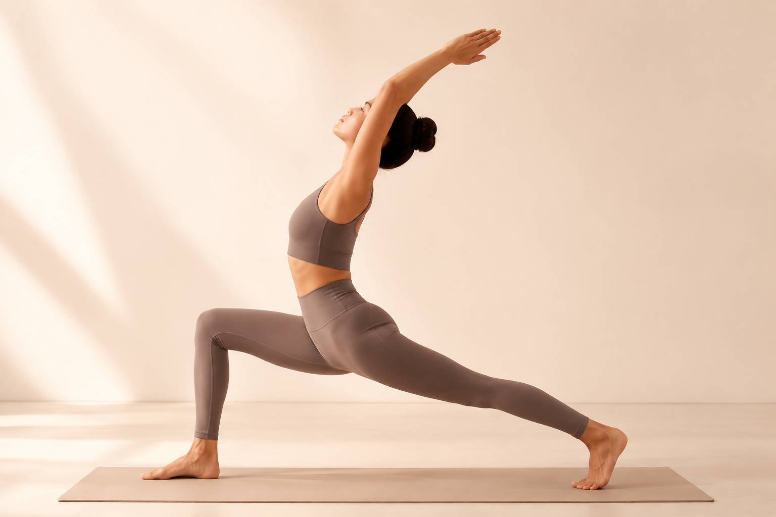A woman wearing yoga clothes is doing yoga.